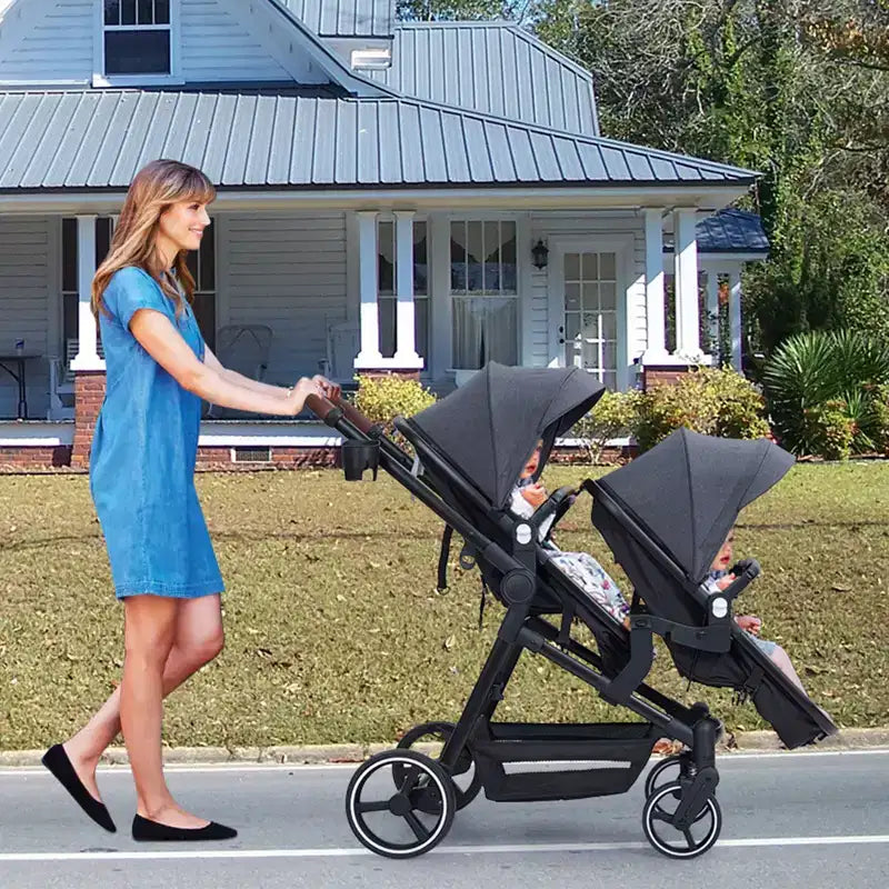 Foldable double stroller for newborns and toddlers with a reversible seat, five-point safety harness, adjustable backrest, and canopy storage basket